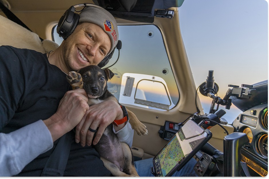 top dog Michael Schneider and a lucky pup in the cockpit